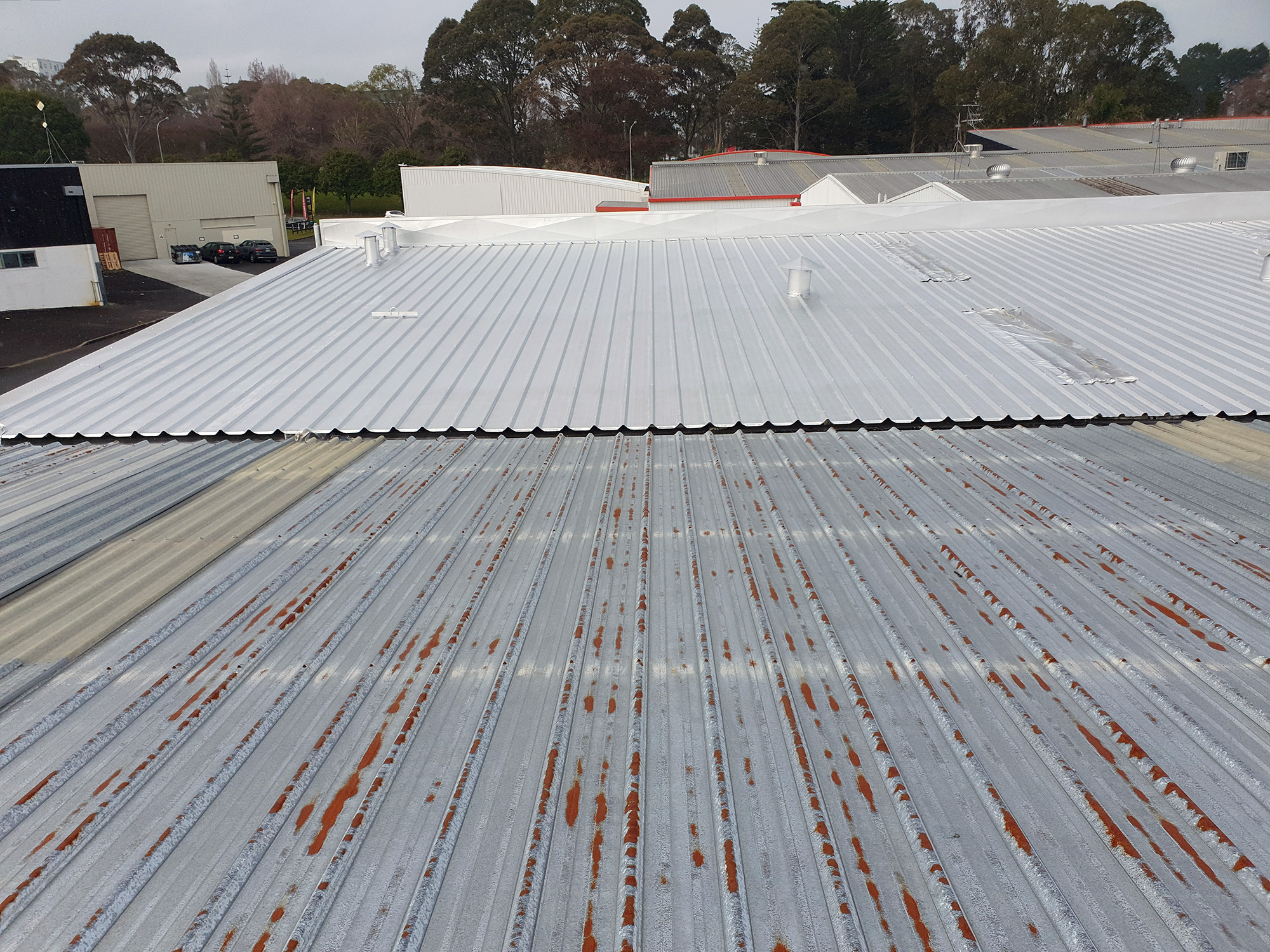 Rusty commercial roof from neighbour - Home