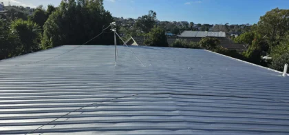 Rusty iron roof in Mairangi Bay after restoration